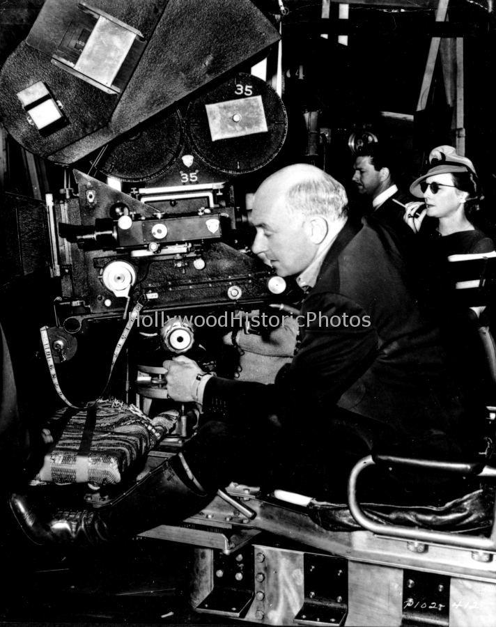 Cecil B. DeMille 1939 Directs Union Pacific female script supervisor looks on.jpg